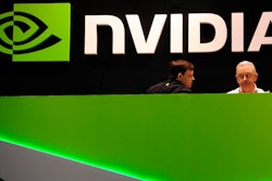 People gather in the Nvidia booth at the Mobile World Congress mobile phone trade show Thursday, Feb. 27, 2014 in Barcelona, Spain. The Federal Trade Commission on Thursday, Dec. 2, 2021 sued to block graphics chip maker Nvidia’s $40 billion purchase of chip designer Arm, saying the deal would create a powerful company that could hurt the growth of new technologies.
