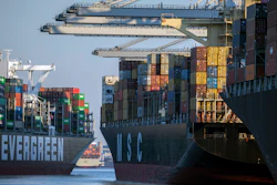 Container ship Ever Far, left, sails down river past the Port of Savannah, Ga., Sept. 29, 2021.