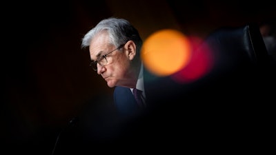 Federal Reserve Board Chairman Jerome Powell listens during his re-nominations hearing before the Senate Banking, Housing and Urban Affairs Committee, Tuesday, Jan. 11, 2022, on Capitol Hill in Washington. With inflation high and the economy strengthening, the Fed has warned investors the ultra-easy conditions it’s created for them in recent years are likely to disappear. It's on track to raise interest rates earlier and more aggressively than expected, and it may also soon start letting go of some of the trillions of dollars of bonds it’s bought since the pandemic began.