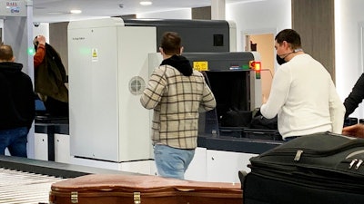 Passengers walk next to Nuctech security scanners at the Brussels Eurostar train terminal on Monday, Jan. 17, 2022. A growing number of Western security officials and policymakers fear that China could exploit Nuctech equipment to sabotage key transit points or get illicit access to government, industrial or personal data from the items that pass through its devices. Nuctech dismisses those concerns, countering that its European operations comply with local laws, including strict security checks and data privacy rules.