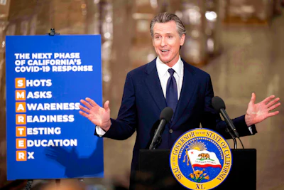 Gov. Gavin Newsom announces the next phase of California's COVID-19 response called 'SMARTER,' during a press conference at the UPS Healthcare warehouse in Fontana, CA on Feb. 17, 2022.