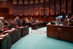 Members of the Arizona House gather at the Capitol in Phoenix, Feb. 18, 2021.