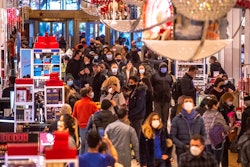 People shop in Macy's on Nov. 26, 2021, in New York. Americans picked up the spending pace in January as the threat of omicron faded and there was some easing of supply shortages. Retail sales rose a seasonally adjusted 3.8% Jan. 2022, compared to the prior month when the number dropped a revised 2.5%.