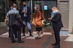 Former Theranos executive Ramesh 'Sunny' Balwani, right, stands near his legal team outside Robert F. Peckham U.S. Courthouse in San Jose, Calif., March 1, 2022.