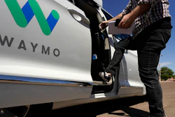 A Waymo minivan arrives to pick up passengers in Mesa, Ariz., April 7, 2021.