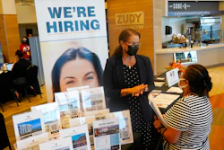 Marriott human resources recruiter Mariela Cuevas, left, talks to Lisbet Oliveros, during a job fair at Hard Rock Stadium, Friday, Sept. 3, 2021, in Miami Gardens, Fla. Fewer Americans applied for unemployment benefits last week, as layoffs continue to decline amid a strong job market rebound. Jobless claims fell by 15,000 to 214,000 for the week ending March 12, 2022 down from the previous week's 229,000, the Labor Department reported Thursday, March 17.