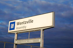 This March 24, 2021, file photo shows a sign near an entrance to a General Motors assembly plant in Wentzville, Mo. Face masks will be optional for U.S. union auto workers, as long as their factories are in counties that are not at high risk for the novel coronavirus. A task force of officials from Ford, General Motors, Stellantis and the United Auto Workers union decided to drop a mask requirement at a meeting on Thursday, March 3, 2022.