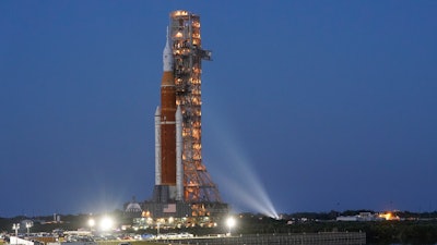The NASA Artemis rocket with the Orion spacecraft aboard leaves the Vehicle Assembly Building moving slowly on an 11-hour journey to pad 39B at the Kennedy Space Center in Cape Canaveral, Fla., Thursday, March 17, 2022. The flight debut of NASA's new mega moon rocket faces additional delays, following a series of failed fueling tests, officials said Monday, April 18, 2022.