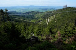 Visitors cross a suspension bridge for the pedestrians that is the longest such construction in the world shortly after its official opening at a mountain resort in Dolni Morava, Czech Republic, Friday, May 13, 2022. The 721-meter (2,365 feet) long bridge is built at the altitude of more than 1,100 meters above the sea level. It connects two ridges of the mountains up to 95 meters above a valley between them.