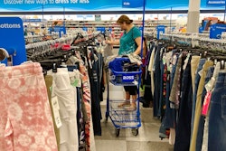 In this July 21, 2021 photo, a consumer shops at a retail store in Morton Grove, Ill. The fastest inflation in 40 years squeezed retailers during the first quarter, alarming investors worried about the broader economy's outlook. Earnings reports from Walmart, Target and Amazon this month showed higher costs are hurting retailers' operations.