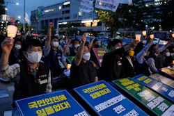 Members of the Public Service and Transport Workers Union rally to support an ongoing trucker strike outside the presidential office in Seoul, June 14, 2022.