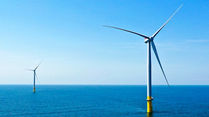 Two of the offshore wind turbines which have been constructed off the coast of Virginia Beach, Va. are seen on June 29, 2020. The White House is launching a formal partnership with 12 East Coast governors to boost the growing offshore wind industry. It's a key element of President Joe Biden's plan for climate change.