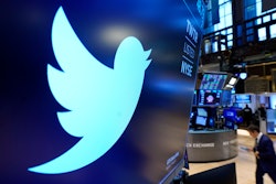 The logo for Twitter appears above a trading post on the floor of the New York Stock Exchange, Nov. 29, 2021. Twitter's stock slid more than 6% before the market open Monday, July 11, 2022, after billionaire Elon Musk announced late Friday that he will abandon his $44 billion offer to buy Twitter and the company said it will sue the Tesla CEO to uphold the deal.