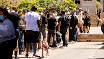 People stand in long lines to receive the monkeypox vaccine at San Francisco General Hospital in San Francisco, Tuesday, July 12, 2022.