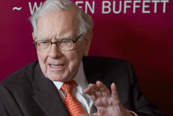 In this May 5, 2019, file photo, Warren Buffett, Chairman and CEO of Berkshire Hathaway, speaks during a game of bridge following the annual Berkshire Hathaway shareholders meeting in Omaha, Neb.