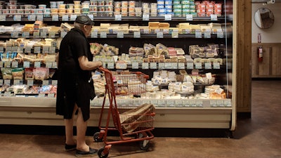 A man shops at a supermarket in New York, July 27, 2022.