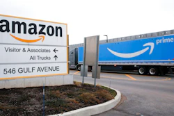 An Amazon Prime truck passes by a sign outside an Amazon fulfillment center on Staten Island, New York, on March 19, 2020. Amazon is heading into its annual Prime Day sales event on Tuesday, July 12, 2022, much differently than how it entered the pandemic. Once the darling of the pandemic economy, the company posted a rare quarterly loss in April as well as its slowest rate of revenue growth in nearly two decades at 7%.
