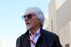 Former Formula One boss Bernie Ecclestone walks in the paddock during the first free practice at the Yas Marina racetrack in Abu Dhabi, United Arab Emirates, Friday Nov. 23, 2018. British prosecutors say former Formula One boss Bernie Ecclestone will be charged with fraud by false representation following a government investigation into his overseas assets.