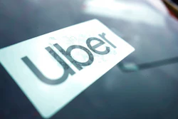 An Uber sign is displayed inside a car in Palatine, Ill., Thursday, Feb. 10, 2022. As Uber pushed into markets around the world, the ride-sharing service lobbied political leaders to relax labor and taxi laws and used a “kill switch″ to thwart regulators and law enforcement. Uber also channeled money through Bermuda and other tax havens and considered portraying violence against its drivers as a way to gain public sympathy. That's according to a report released Sunday by the International Consortium of Investigative Journalists.