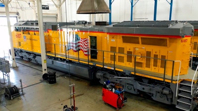 In this photo provided by Wabtec, a completed modernized Union Pacific locomotive is prepped for delivery at Wabtec's Fort Worth plant in Fort Worth, Texas, in October 2021. Union Pacific will spend more than $1 billion to upgrade 600 of its old diesel locomotives over the next three years and make them more efficient, but regulators still want it to do more to cut pollution from its engines.