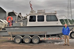 Mark Manning poses with the newly renamed survey vessel, the M/V Chasteen, named in honor of Darian Chasteen. Chasteen recently passed away, losing a hard-fought battle with cancer.