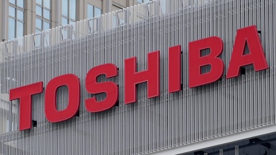The logo of Toshiba Corp. is seen at a company's building in Kawasaki near Tokyo, on Feb. 19, 2022. Toshiba reported Wednesday, Aug. 8, 2022, a 44% improvement in profit for the first fiscal quarter as the Japanese technology giant sought to revamp its brand image and reassure investors about its management.