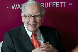 Warren Buffett, chairman and CEO of Berkshire Hathaway, smiles as he plays bridge following the annual Berkshire Hathaway shareholders meeting in Omaha, Neb., on May 5, 2019. Warren Buffett's company bet more on high-tech darlings Apple and Amazon during the second quarter of 2022 while also investing billions in old school oil producers Occidental Petroleum and Chevron.