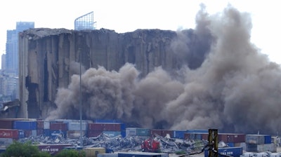 A section of Beirut's massive port grain silos, shredded in the 2020 explosion, collapsed on Sunday after a weekslong fire triggered by grains that had fermented and ignited in the summer heat.