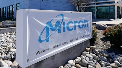 A sign marks the entrance of the Micron Technology automotive chip manufacturing plant on Feb. 11, 2022, in Manassas, Va.
