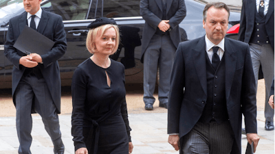 British Prime Minister Liz Truss and her husband Hugh O'Leary arrive for the funeral service of Queen Elizabeth II at Westminster Abbey in central London, Monday Sept. 19, 2022. The Queen, who died aged 96 on Sept. 8, will be buried at Windsor alongside her late husband, Prince Philip, who died last year.