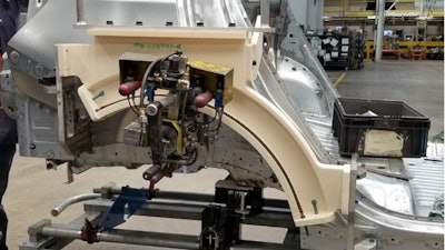 The rear wheelhouse hemming tool (ivory) used on the production Chevrolet Equinox is used to join the inner and outer sheet metal fender panels. The tool is traditionally machined from aluminum and requires lead times of more than 10 weeks. GM recently 3D printed the tool on a Stratasys F900 printer using FDM ASA thermoplastic material rather than machine it from an aluminum billet. The new tool was produced in three weeks, reduced weight from 75 pounds to 33 pounds and reduced total cost by 74%.