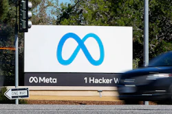 A car passes Facebook's new Meta logo on a sign at the company headquarters on Oct. 28, 2021, in Menlo Park, Calif.