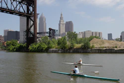 Two rowers paddle along the Cuyahoga River in Cleveland on July 12, 2011. Tuesday, Oct. 18, 2022, is the 50th anniversary of Congress passing the Clean Water Act to protect U.S. waterways from abuses like the oily industrial pollution that caused Ohio's Cuyahoga River to catch on fire in 1969.