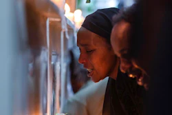 Ethiopian relatives of some of the crash victims light candles and gather at an anniversary memorial service at the Holy Trinity Cathedral in Addis Ababa, Ethiopia, March 8, 2020, to remember those who died when Ethiopian Airlines flight ET302, a Boeing 737 Max, crashed shortly after takeoff on March 10, 2019, killing all 157 on board. A federal judge ruled Friday, Oct. 21, 2022, that relatives of people who were killed in the crashes of two Boeing 737 Max planes are crime victims under federal law, finding that the Justice Department should have notified families before privately negotiating a settlement that spared Boeing from criminal prosecution.
