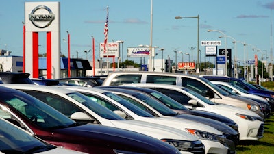 Cars for sale line the road at a used auto dealership in Philadelphia, Thursday, Sept. 29, 2022. The prices of new and used vehicles in the United States have begun inching down from their eye-watering record highs as more vehicles have become gradually available at dealerships.