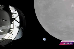 This screengrab from NASA TV shows NASA's Orion capsule, left, nearing the moon, right, Monday, Nov. 21, 2022. At center is earth.