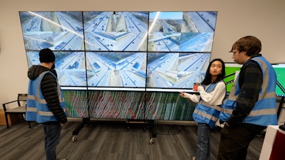Researchers look at live interstate traffic images and data screens Nov. 17, 2022, in Nashville, Tenn.