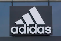 A sign is displayed in front of an Adidas retail store in Paramus, N.J., Tuesday, Oct. 25, 2022. Adidas has ended its partnership with the rapper formerly known as Kanye West over his offensive and antisemitic remarks, the latest company to cut ties with Ye and a decision that the German sportswear company said would hit its bottom line.