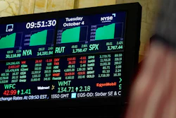 A display shows most indices up on the floor at the New York Stock Exchange in New York, Tuesday, Oct. 4, 2022. Corporate profits have withstood raging inflation over much of the last year, but those good times may be ending. Profits stayed fat even as companies’ costs rose thanks to one simple trick: Businesses boosted the prices they charged customers by more than their own costs rose.