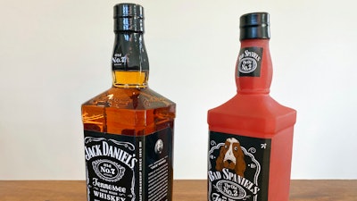 A bottle of Jack Daniel's Tennessee Whiskey is displayed next to a Bad Spaniels dog toy in Arlington, Va., Sunday, Nov. 20, 2022. Jack Daniel's has asked the Supreme Court justices to hear its case against the manufacturer of the toy.