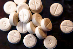 Oxycodone pills are shown, June 17, 2019. On Wednesday, Nov. 2, 2022, CVS Health said it has agreed to pay about $5 billion to state, local and Native American tribal governments to settle lawsuits over the toll of opioids. CVS is not admitting wrongdoing and the company would make the payments over a decade.