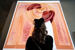 A visitor looks at artist Refik Anadol's 'Unsupervised' exhibit at the Museum of Modern Art, Wednesday, Jan. 11, 2023, in New York.