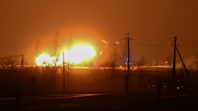 A flame rises after an explosion at a gas pipeline near Pasvalys, 175 km (109 miles) north of Vilnius in northern Lithuania on Friday, Jan. 13, 2023.