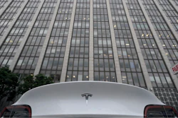 A Tesla car is parked in a lot across the street from a federal courthouse in San Francisco, Wednesday, Jan. 18, 2023.