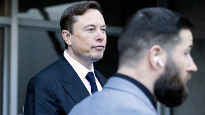 Elon Musk leave the Phillip Burton Federal Building and United States Court House in San Francisco, Tuesday, Jan. 24, 2023.