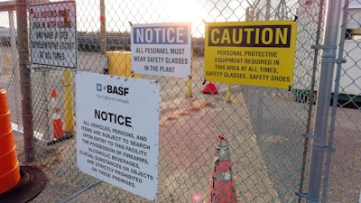 A gate at the entrance to the former Ciba Geigy chemical plant in Toms River, N.J., is filled with warning on Tuesday, Jan. 24, 2023, regarding the contaminated area, which is on the Superfund list of the nation's worst toxic waste sites.
