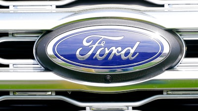 A logo on a vehicle at a Ford dealership in Springfield, Pa., Tuesday, April 26, 2022. The U.S. government’s road safety agency is investigating complaints that windshield trim panels can fly off of Ford Explorers while they’re traveling at highway speeds, Tuesday, Jan. 31, 2023. The National Highway Traffic Safety Administration says it has 164 complaints about the trim pieces detaching on 2011 through 2019 Explorer SUVs.