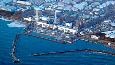 This aerial photo shows the Fukushima Daiichi nuclear power plant in Okuma town, Fukushima prefecture, north of Tokyo, on March 17, 2022. Japan's government has revised the timing of a planned release to the sea of treated but still radioactive wastewater at the Fukushima nuclear power plant to “around spring or summer,' indicating a delay from the initial target of this spring, factoring into the progress of a release tunnel and the need to gain public support.