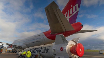 In this undated photo provided by Virgin Orbit on Monday, Jan. 9, 2023, Virgin Atlantic Cosmic Girl, a repurposed Virgin Atlantic Boeing 747 aircraft that will carry a rocket, is parked at Spaceport Cornwall, at Cornwall Airport in Newquay, England. Engineers are making final preparations for the first satellite launch from the U.K. later Monday, when a repurposed passenger plane is expected to release a Virgin Orbit rocket carrying several small satellites into space.