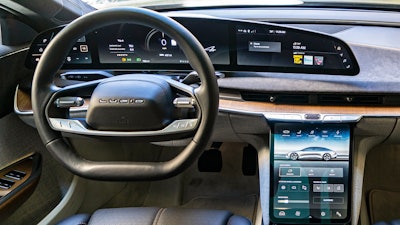This photo provided by Edmunds shows the interior of the 2022 Lucid Air, an electric vehicle whose software allows it to add features via over-the-air updates.